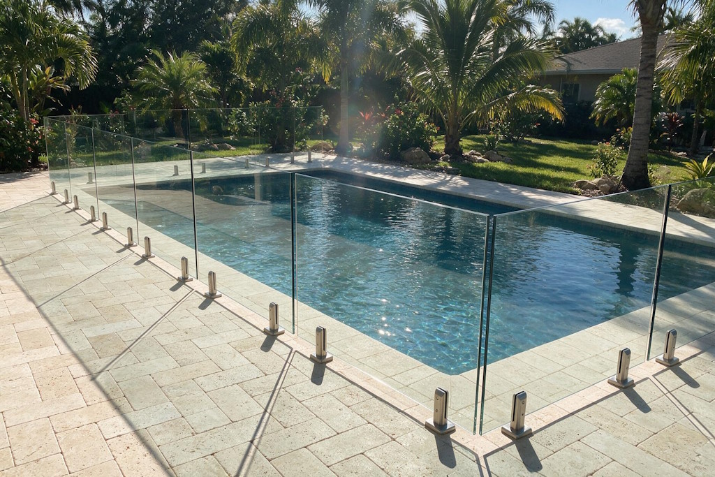 frameless glass pool fence travertine deck