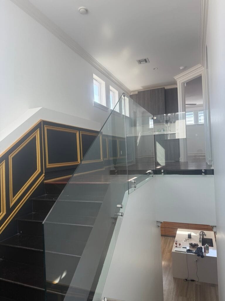 Frameless glass staircase railing in a South Florida home