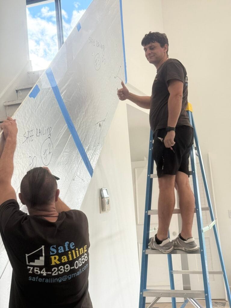 Safe Railing installation team on a glass railing project in Boca Raton